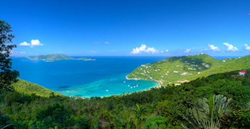 The floating divan on the beach at the BVI rental villa Aquamare on Mahoe Bay