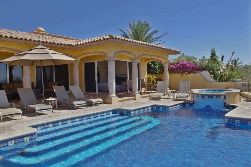 View of the pool and outdoor sunbeds
